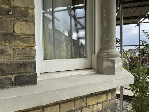 Bay window sill and column base filled and smoothed in grey, ready for painting